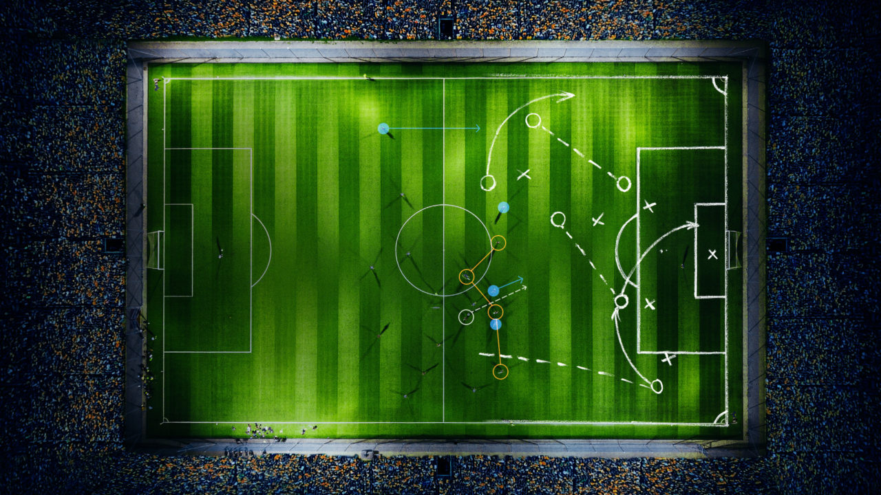 Visualisation of a football stadium at night from above with tactical instructions on the field