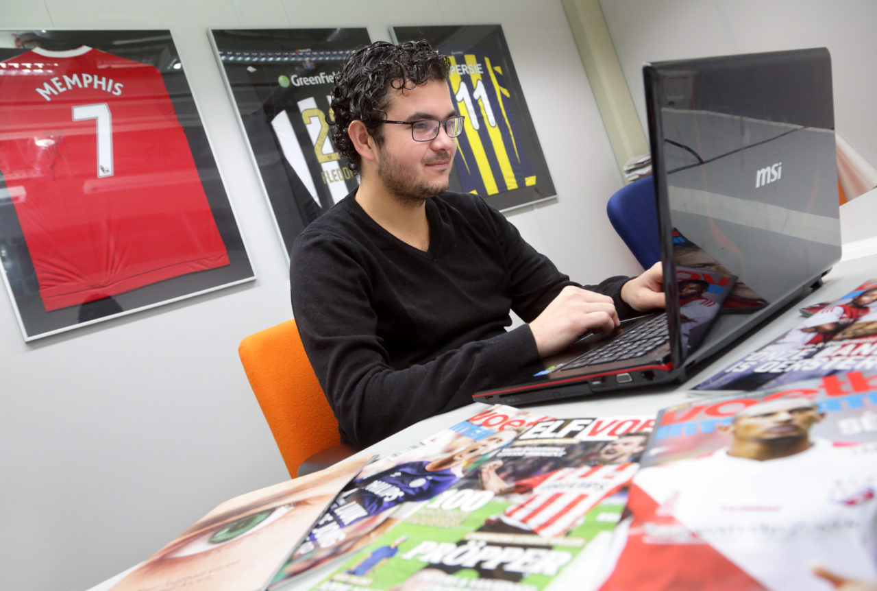 Image of Founder Giels Brouwer working on his laptop at SciSports