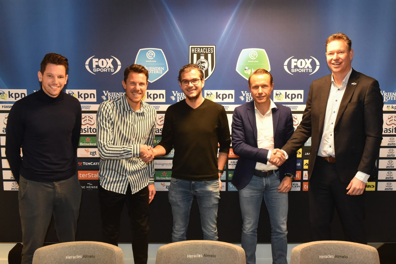 Picture of SciSports and Heracles Almelo's contract signing where both parties shake hands